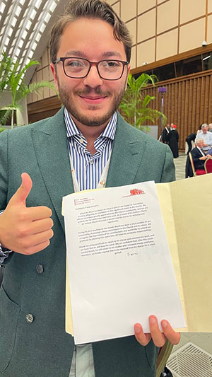 man holding a copy of a letter