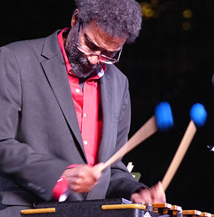 man holding mallets and playing a musical instrument