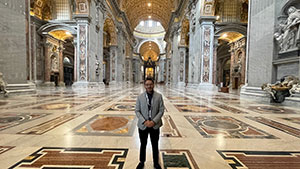 man standing in a large, ornate space