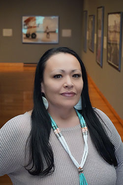 woman with museum paintings in the background