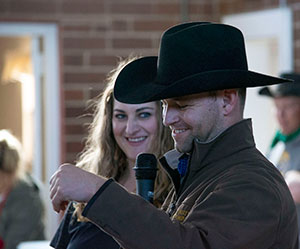 woman and man at a microphone