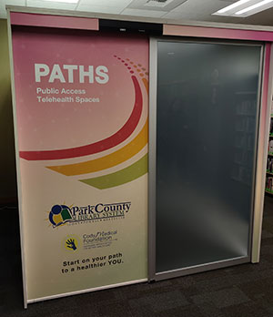 booth with the word PATHS on the door