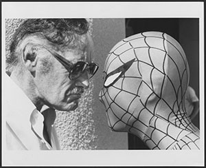 man face-to-face with man in Spiderman costume