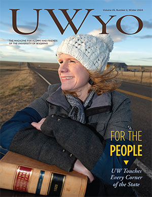 woman with books in front of an open highway