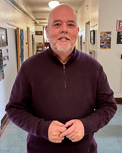 man standing in a hallway