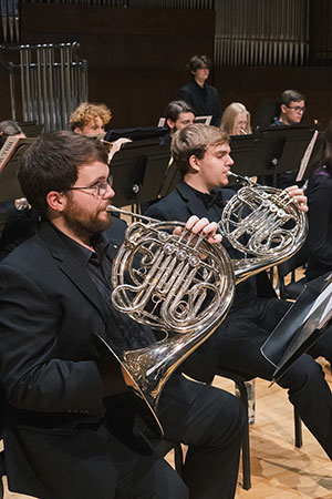 people playing French horns