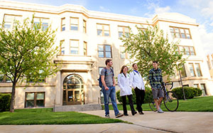 people walking in front of a building on the UW campus