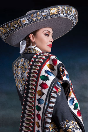woman in mariachi sombrero and shoulder throw