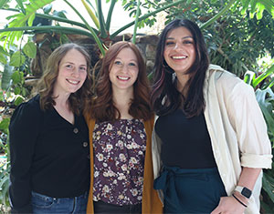 three people posing together