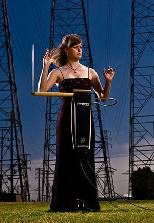 woman posing dramatically in front of metal power towers
