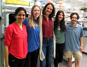 group of people posing in a lab