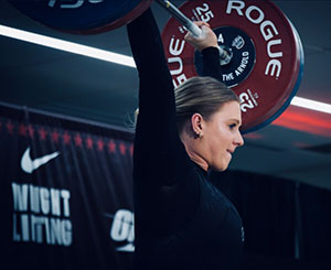 woman lifting a weight over her head