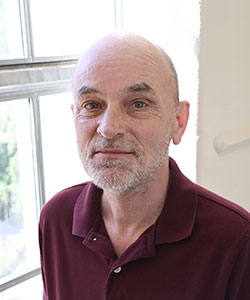 man standing by a window