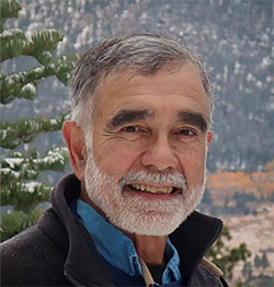 head photo of a man standing outside