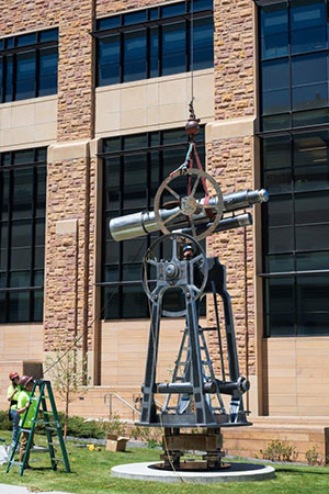 sculpture with a telescope as part of it