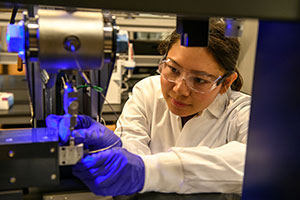 person using lab equipment