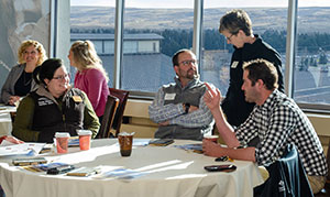people sitting at a table and talking