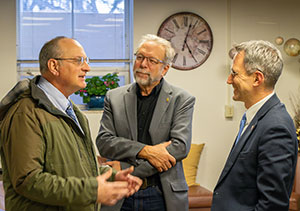 three men talking