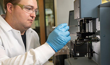 person using lab equipment