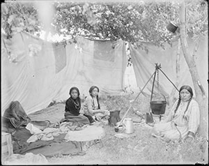 vintage black and white photo of a group of Native American women cooking outdoors