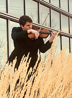 person playing a violin outside