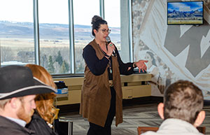 woman speaking into a microphone