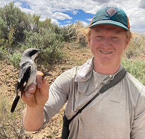 man holding a bird
