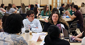 large number of people sitting at tables