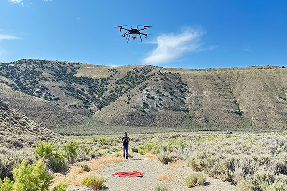 man flying a drone