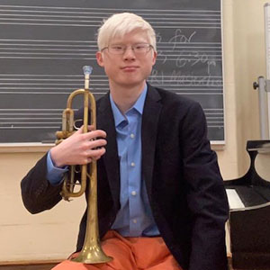 photo of a man holding a trumpet