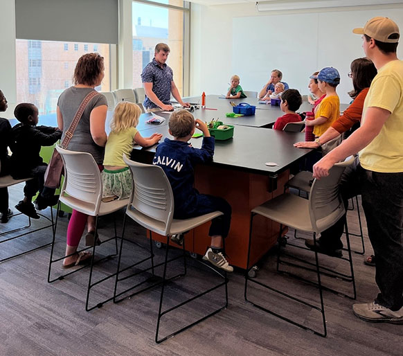 adults and children gathered around tables