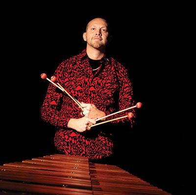 man standing at a percussion instrument