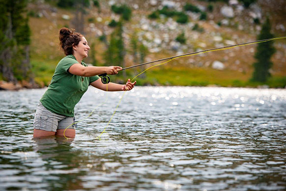 woman fly fishing
