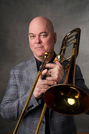 man holding a trombone