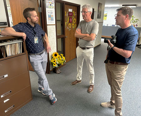 three men talking