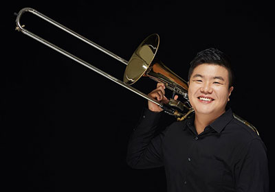 man holding a trombone