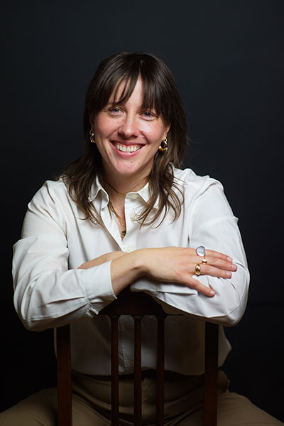 woman sitting backwards on a chair