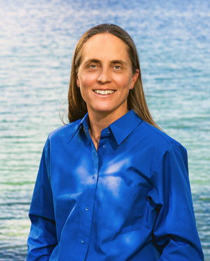 photo portrait of a woman with water as the background