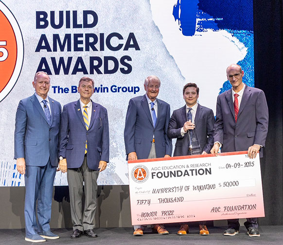 group of people presenting an oversized check
