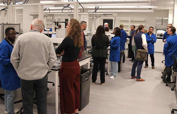 people gathering in a laboratory space