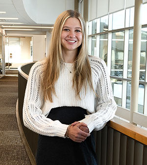 woman standing in a hallway