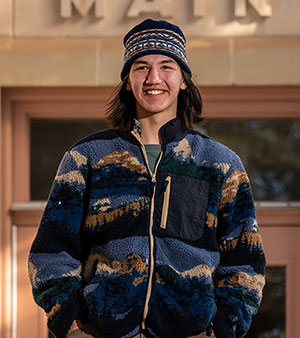 man standing in front of a building