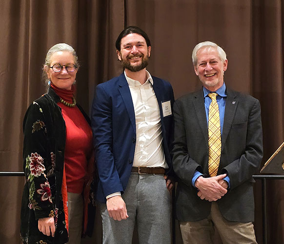 three people posing together