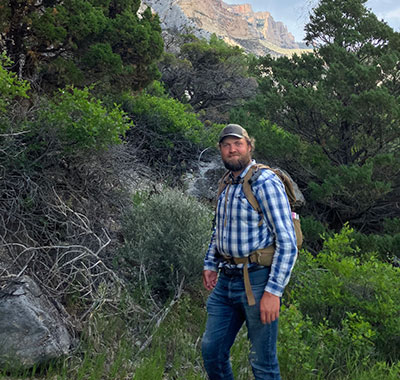 man with a backpack in the mountains