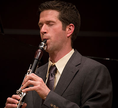 man playing a clarinet