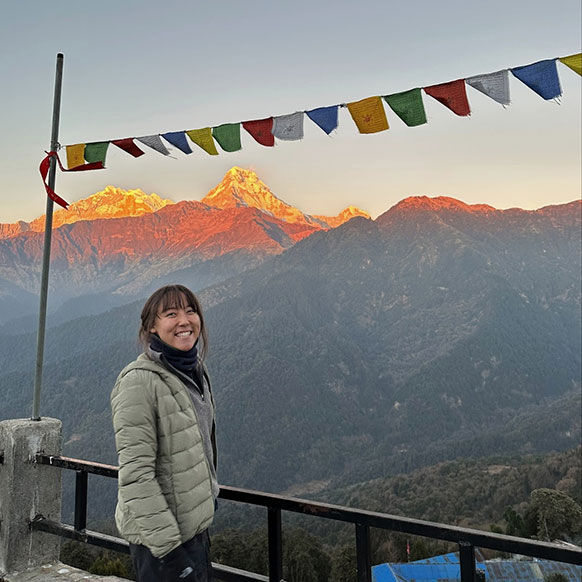 woman standing at a mountain overlook