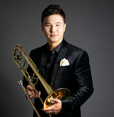 man holding a trombone