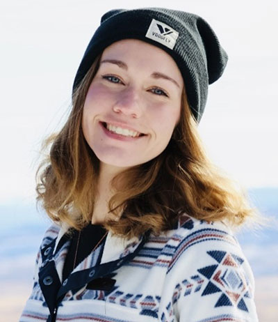woman outside in snowy mountains