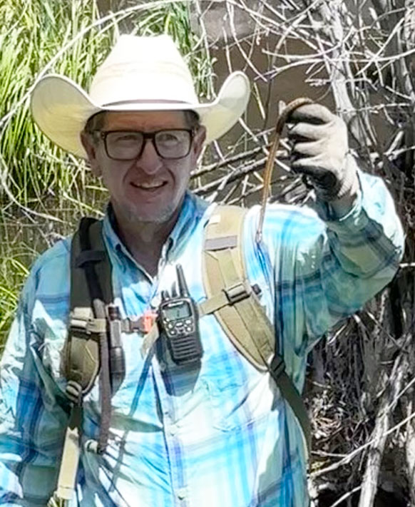 man holding up a snake