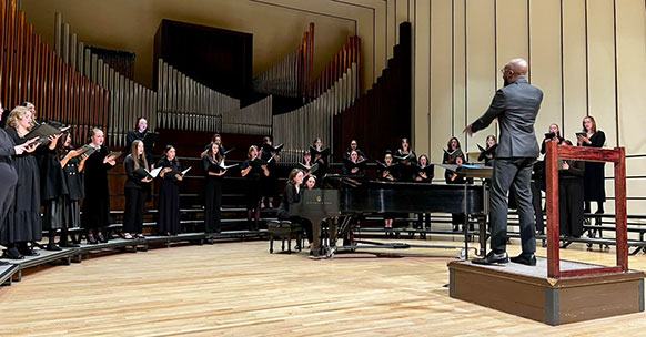 man conducting a choir